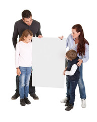 Cheerful young preseting a banner board