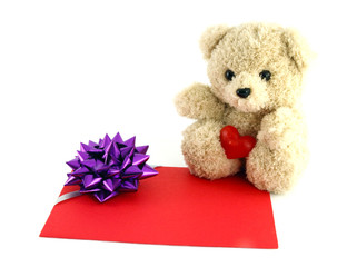 Wall Mural - teddy bear toy with a gift card, isolated on white background