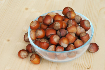 Wall Mural - Hazelnuts on a wooden table