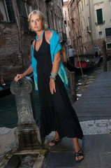 Wall Mural - Venice, Italy - woman in black dress on the bridge in Venice