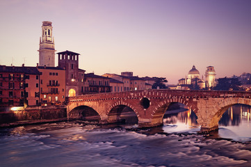 Wall Mural - Ponte Pietra and the River Adige at night..