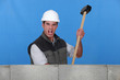 Angry man holding sledge-hammer