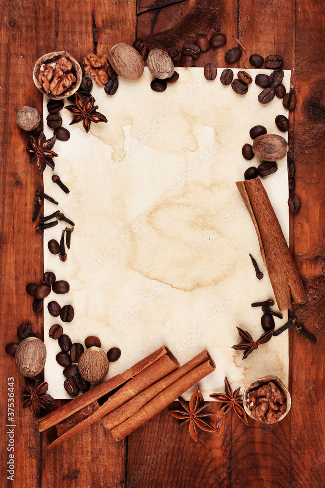 old paper for recipes and spices on wooden table