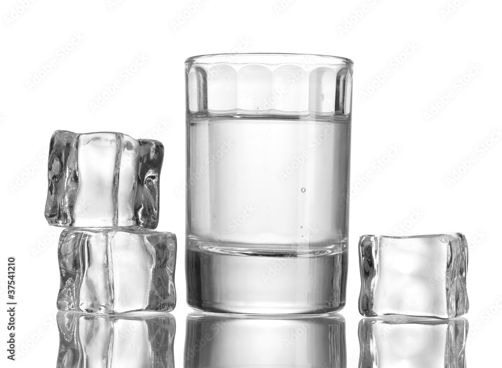glass of vodka with ice isolaled on white