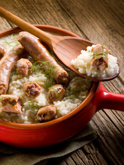 Poster - risotto with sausage over red casserole