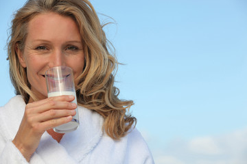 portrait of a woman with glass of milk