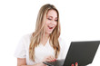 © dacasdo - A woman doctor is surprised and looking at her laptop.