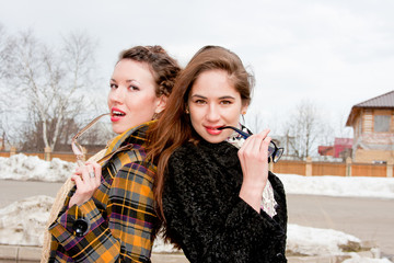 Two  woman with glasses in the park