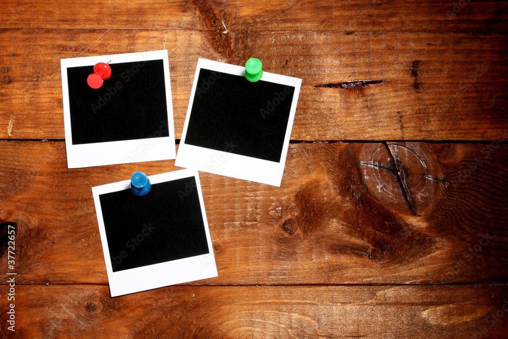 Photo papers on wooden background