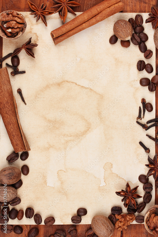 old paper for recipes and spices on wooden table