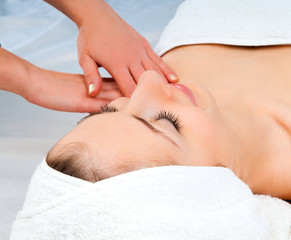 Wall Mural - woman receiving facial massage