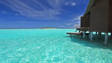 Wall Mural - Over water bungalow with steps into blue lagoon