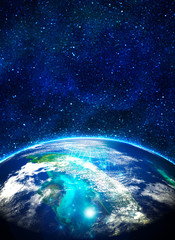 blue earth in space with rising sun