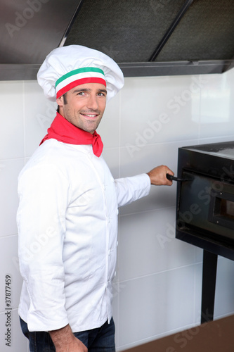 Fotoboard na płycie Włoski kucharz obok pieca do pizzy