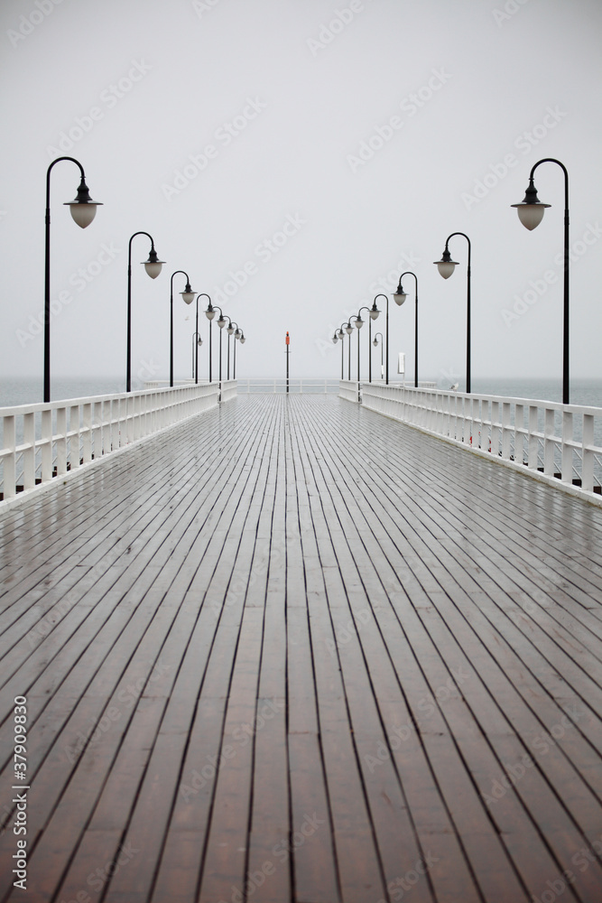 old pier in rain on Baltic sea Orlowo Gdynia Poland - obrazy, fototapety, plakaty 