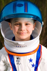 cute young boy in an astronaut suit