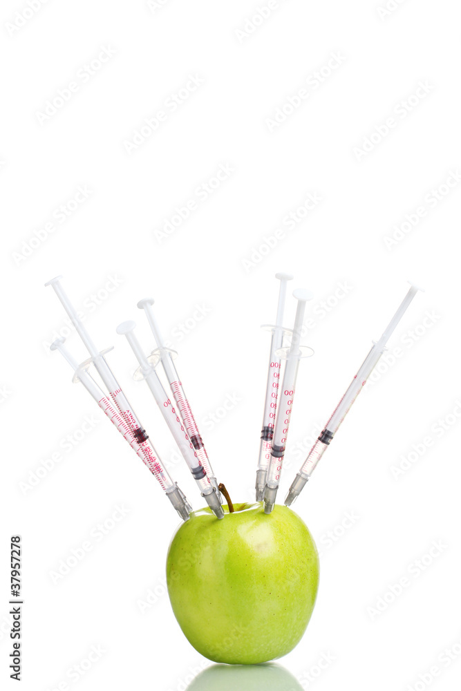 green apple and syringes isolated on white