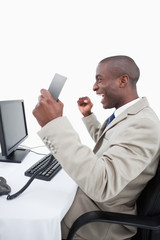 Wall Mural - Portrait of a successful salesman holding a phone handset