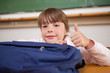 © WavebreakmediaMicro - Schoolgirl posing with a bag and the thumb up