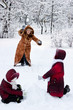© Natalya Antoshchenko - Family cheerfully play to snow