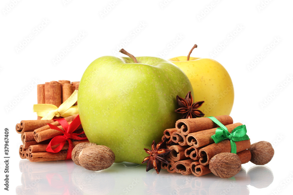 Cinnamon sticks, apples, nutmeg and anise isolated on white