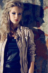 Wall Mural - beautiful blond woman wearing leather jacket