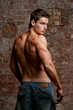 © IgorKireev - Muscular young naked sexy man in jeans