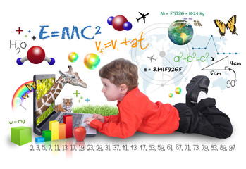 Wall Mural - young boy on laptop computer learning