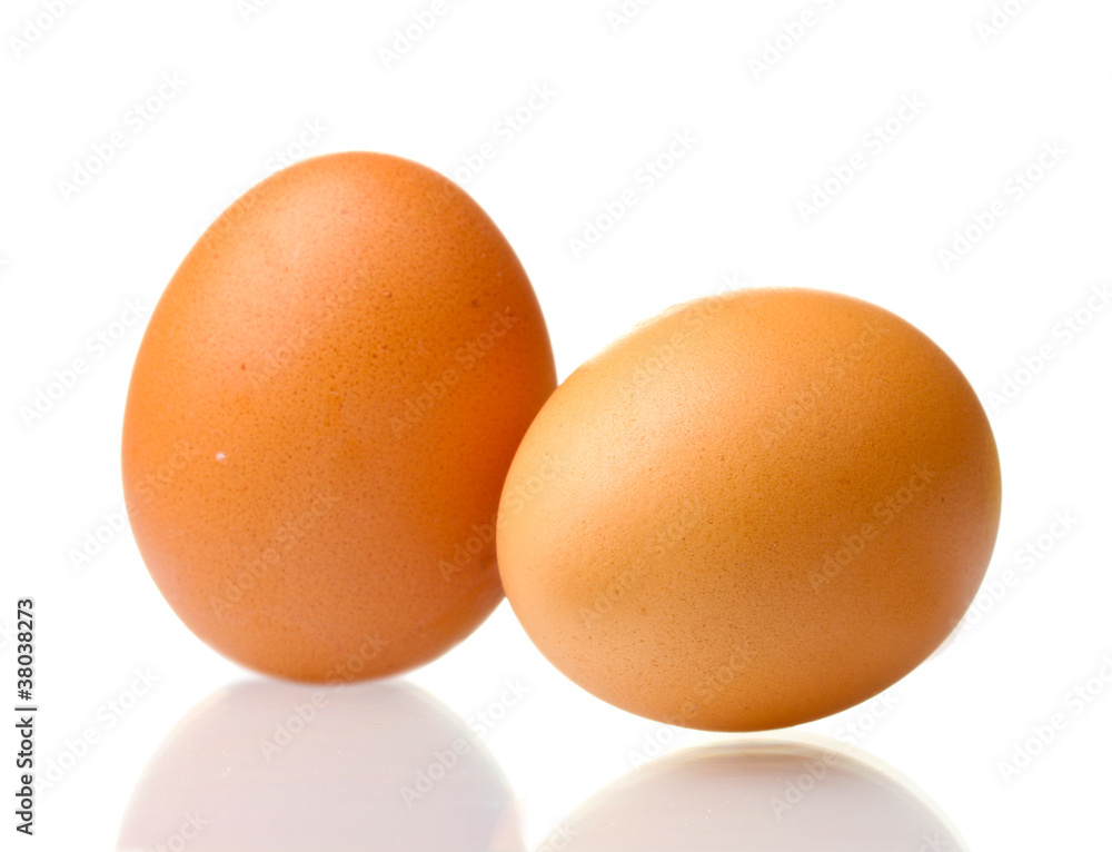 two brown eggs isolated on white