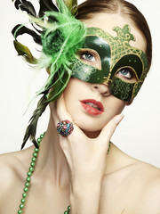 Canvas Print - The beautiful young woman in a green mysterious venetian mask