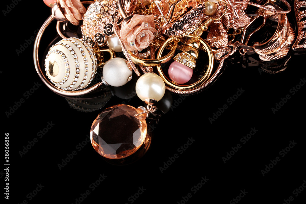 Various gold jewellery on black