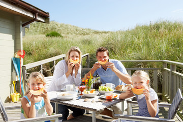 Wall Mural - Family on vacation eating outdoors