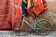 Bicycle and carpets on the street of Morocco