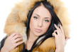 Beautiful girl in a fur hood
