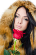 The girl with beautiful hair with a red rose