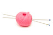 © Konyakhina Daria - pink ball and knitting needles on a white background
