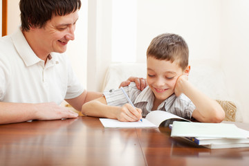 Father helping son do homework