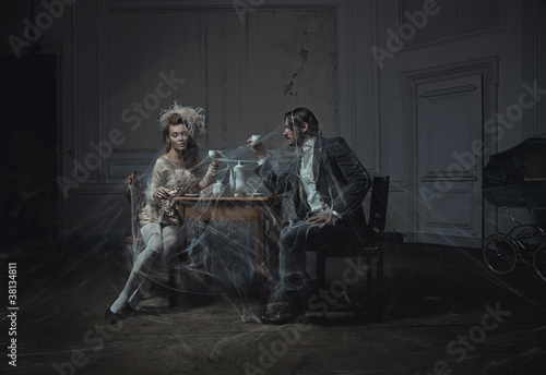 Fototapeta do kuchni Young couple drinking coffee in an old castle