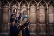 © Nejron Photo - Two knights fighting agaist medieval cathedral wall.