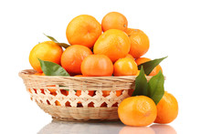 Tangerines With Leaves In A Beautiful Basket Isolated On White