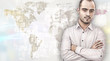 © Milles Studio - Portrait of young businessman. Standing against world map with p