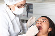 canvas print picture - Patientin mit offenem Mund während Zahnkontrolle