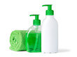 Isolated bathroom objects. Two bottles of liquid soap and towel on white background