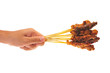 Hand Holding Sticks Of Satay, Barbecued Meats