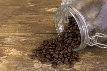 coffee beans spilling out of a jar