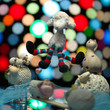 group sheep toys playing, colorful lights background