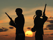 Duellists silhouetted against the rising sun
