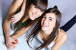 © nenetus - studio portrait of brunette sisters