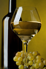 Wall Mural - A glass of wine, bottle and grapes