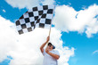 © Monika Wisniewska - Man waving a checkered flag on a raceway